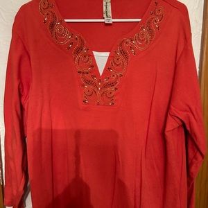 3/4 length pullover with embellishments.